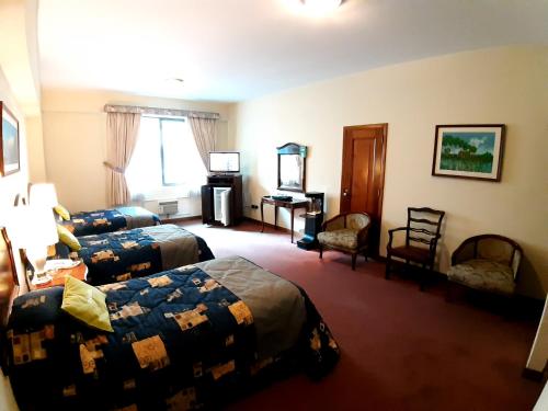 Postel nebo postele na pokoji v ubytování Hotel MAURY