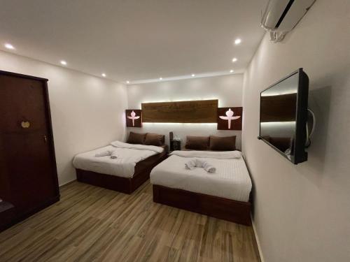 Cama o camas de una habitación en Sahara Pyramids Inn