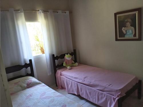 En eller flere senge i et værelse på Casa Pousada Vila Verde