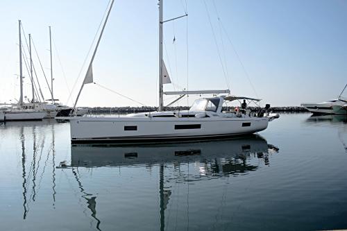 a white sail boat sitting in the water at Yacht Psari in Thessaloniki