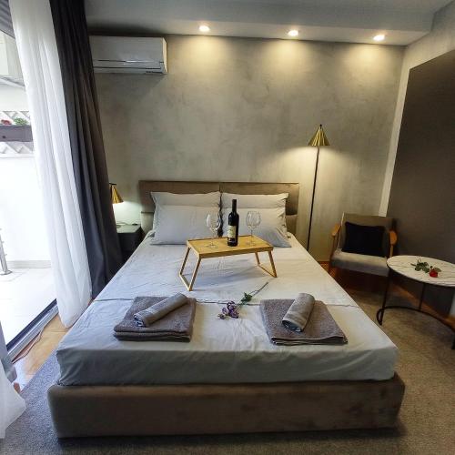 a bedroom with a bed with two towels on it at KaLuMa in Belgrade