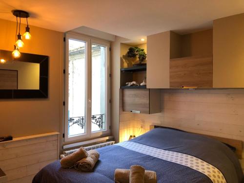 Posteľ alebo postele v izbe v ubytovaní RDC 1 - Chambre meublée au cœur du centre ville de Montluçon