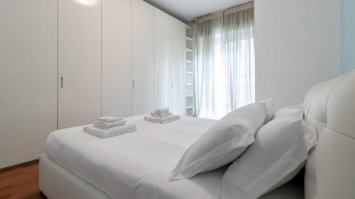 Tempat tidur dalam kamar di Italianway - Carducci 21