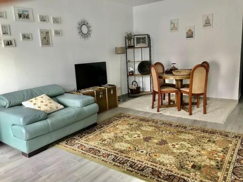 a living room with a couch and a table at Casa do Reguengo 1 in Estremoz