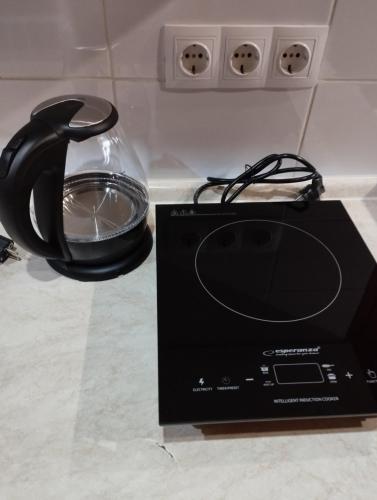 a black telephone and a box on a counter at Balti house in Bălţi