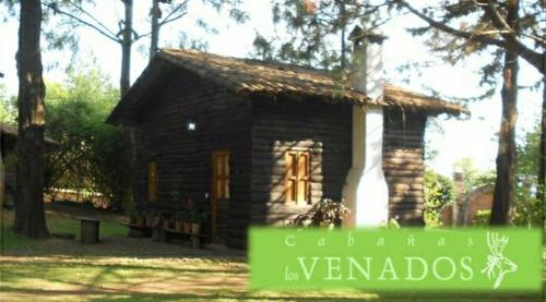 a small house with a sign in front of it at Cabañas los Venados in Mazamitla