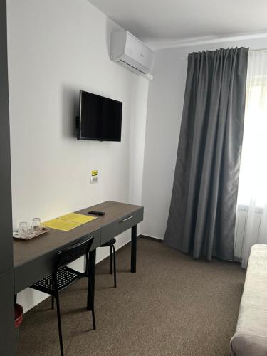 TV a/nebo společenská místnost v ubytování Stef Rooms