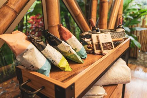 a wooden shelf with pillows on it at The Coffee Club Campestre in Chinchiná