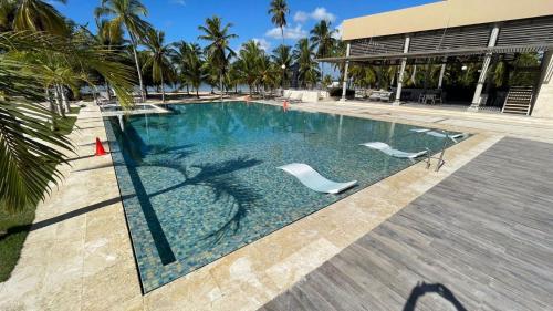 Der Swimmingpool an oder in der Nähe von Beach front and golf paradise. Playa Nueva Romana