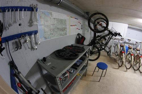 a kitchen with a stove and a bike hanging on a wall at Villa Badi in Umag