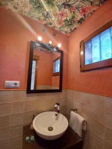 a bathroom with a sink and a mirror at Altea Old Town Paraiso in Altea