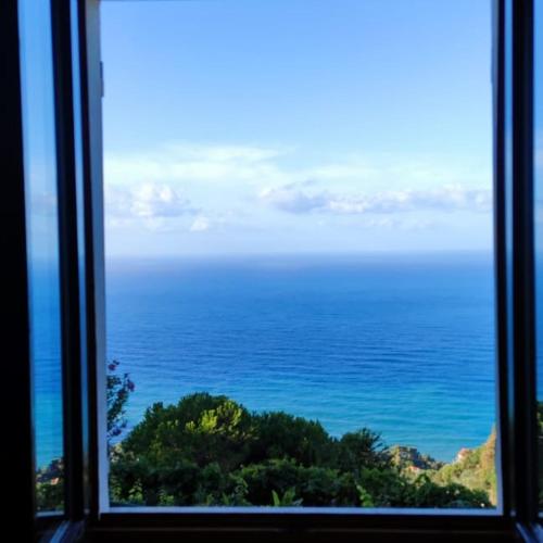 a view of the ocean from a window at Ostello ninin de ma' in Framura