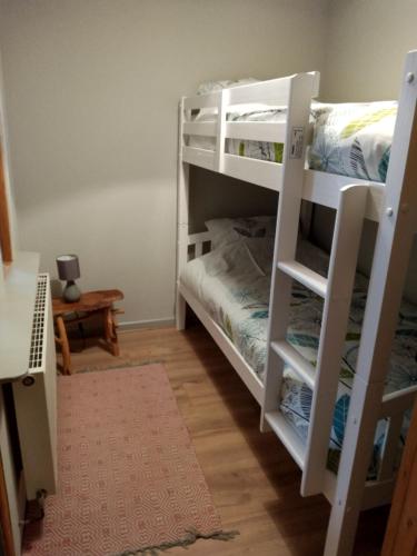 a room with two bunk beds and a bed at self contained flat in Llanfyllin Powys in Llanfyllin