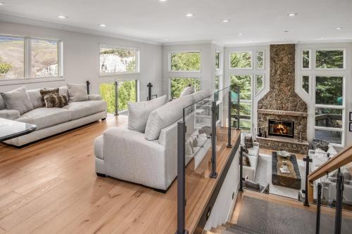 a living room with a couch and a fireplace at Welcome to the Modern Mountain Luxury! home in Avon