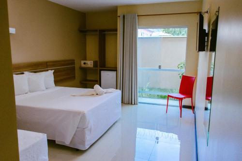 Postel nebo postele na pokoji v ubytování Pontal Praia Hotel