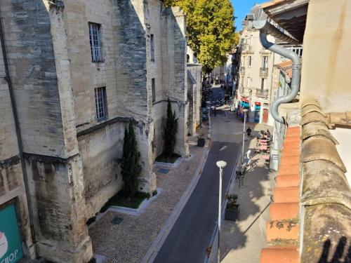 a view of a street from a building at Studio Avignon place des corps saints in Avignon
