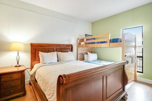 a bedroom with a bed with a bunk bed at Sand & Sea: Rare Ruby (218) in Seaside