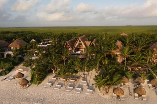 an aerial view of a resort on the beach at La Valise Tulum in Tulum