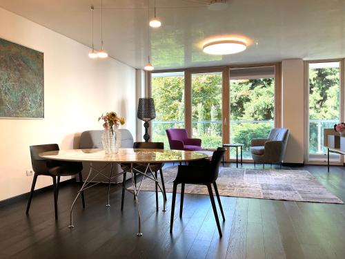 a dining room with a table and chairs at Grand Apartment Sissi in Trieste