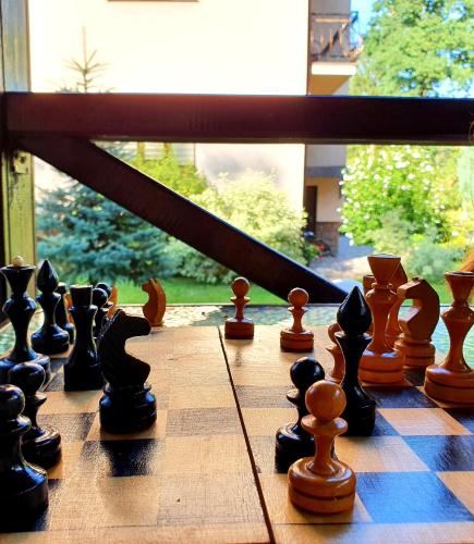 a chess board with chess pieces on it at Villa ZENKO in Lviv
