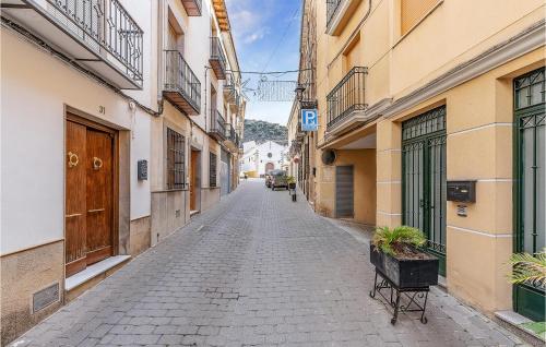 a cobblestone street in an alley between buildings at Cozy Home In Torres With Wifi in Torres