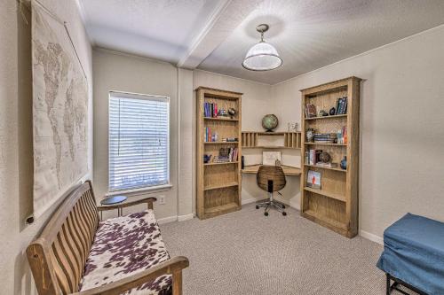a room with a bed and a desk and book shelves at Peaceful Alto Home with Deck about 12 Mi to Ski Apache! in Alto