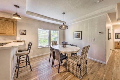 a kitchen and dining room with a table and chairs at Peaceful Alto Home with Deck about 12 Mi to Ski Apache! in Alto