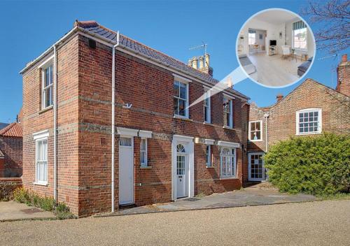 a large brick building with a magnifying glass at The Hideaway in Southwold