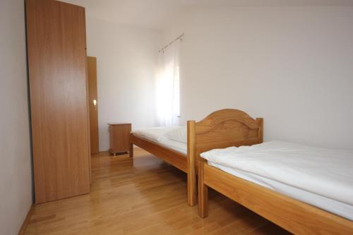 Ένα ή περισσότερα κρεβάτια σε δωμάτιο στο Apartment Artatore 8022d