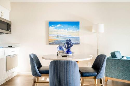 a kitchen and dining room with a table and chairs at Premium Villa - Ocean View - SEASCAPE - Heated Pools - Relaxing Fireplace - Ground Level in Aptos