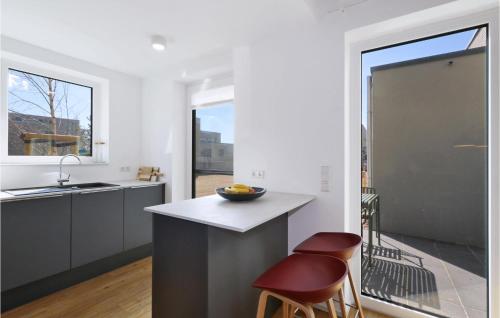 a kitchen with a counter with a bowl on it at Lovely Home In Lembruchdümmer See in Lembruch