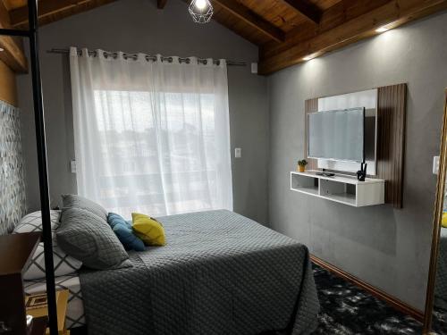 Katil atau katil-katil dalam bilik di Moradas Desterro, próximo ao aeroporto APTO 22