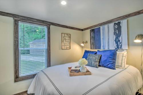 a bedroom with a large bed and a window at Morganton Tiny Home Less Than 5 Mi to Blue Ridge Lake in Morganton