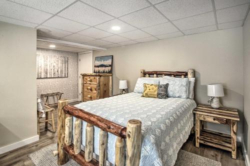 a bedroom with a bed with a wooden bed frame at Family-Friendly Greenwood Home with Lake Access in Greenwood