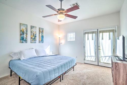 a bedroom with a bed and a ceiling fan at Cave Creek Retreat with Private Pool and Hot Tub! in Cave Creek