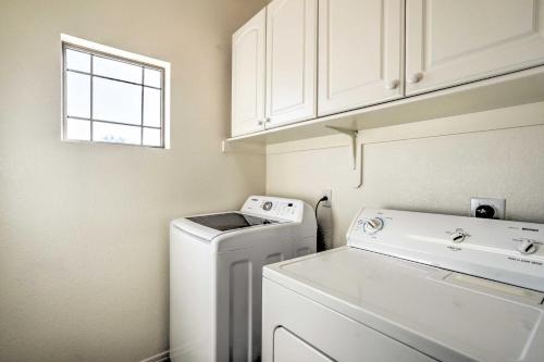 a laundry room with a washing machine and a window at Cave Creek Retreat with Private Pool and Hot Tub! in Cave Creek