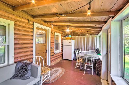a kitchen and dining room of a tiny house at Crivitz Lakefront Escape with Boat Dock and Slip! in Crivitz