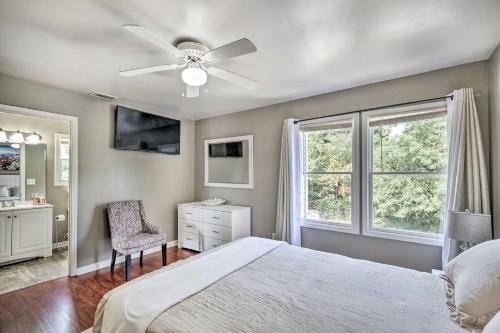 a bedroom with a bed and a ceiling fan at Louisville Apartment - Walk to Restaurants! in Louisville