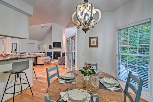 a dining room and living room with a table and chairs at Gorgeous Pinehurst No 6 Home with Two Patios! in Pinehurst