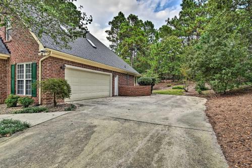 a house with a driveway and a garage at Gorgeous Pinehurst No 6 Home with Two Patios! in Pinehurst