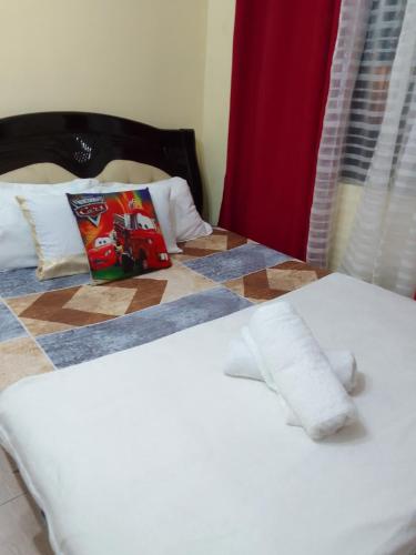 a close up of a bed in a room at Affordable Condo for Rent in Valley Mansions in Cainta