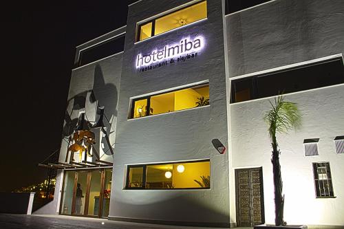a building with a sign on the side of it at Hotel Miba in Salobreña
