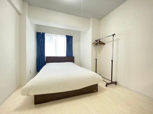 Llit o llits en una habitació de Easy Access to downtown area, Sapporo Dome AMS503