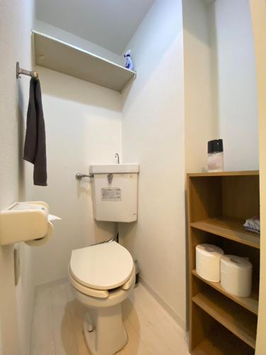 a bathroom with a white toilet in a room at Easy Access to downtown area, Sapporo Dome AMS503 in Sapporo