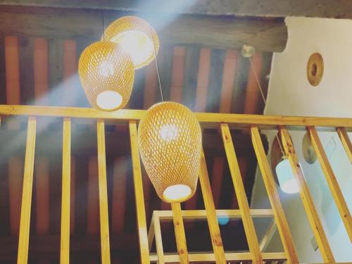 two lights on top of a stair railing at Zhu Shan Xian Ting in Jincheng