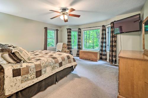 a bedroom with a bed and a ceiling fan at Bellaire Home with Golf Course View and Pool Access! in Bellaire