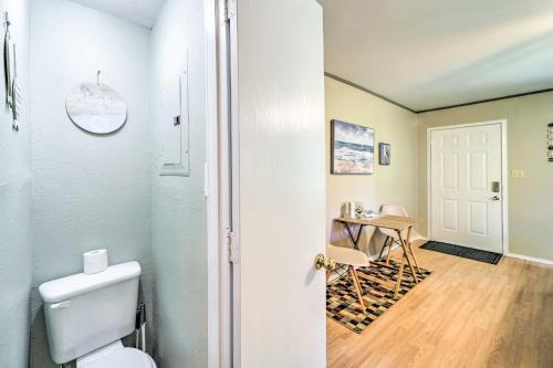 a bathroom with a toilet and a table at Mountainburg Apt Less Than 5 Mi to Lake Fort Smith! in Chester