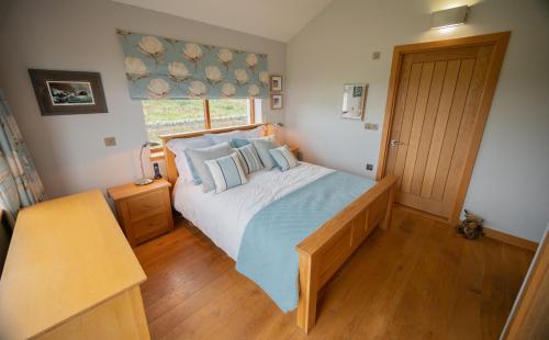 A bed or beds in a room at The Steading