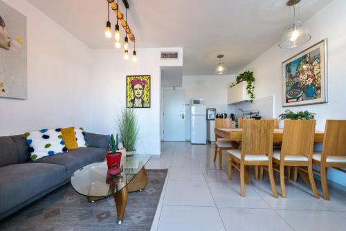 a living room with a couch and a table at מלוני דירות נופש אילת - Melony Apartments Eilat in Eilat