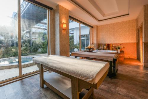 a room with two massage tables and a window at Crystal Waterworld Resort & Spa - Ultimate All Inclusive in Belek